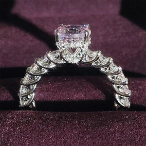 Luxury oval cut zircon engagement ring with hidden halo and pavé band in white gold finish