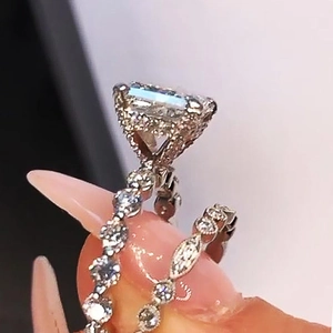 Sparkling silver tone jewelry set with emerald cut zircon and pavé diamond rings