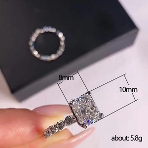 Macro shot of silver ring with 8x10mm rectangular main stone and pave band details