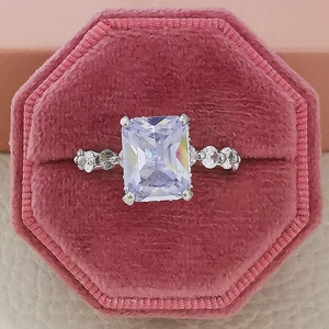Elegant silver wedding ring set with rectangle radiant cut zircon in a pink velvet box