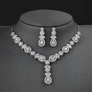 Elegant silver-toned necklace and teardrop earrings jewelry set with cubic zirconia crystals