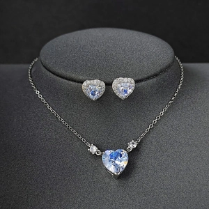 Romantic heart pendant necklace and halo stud earrings set with sparkling crystals