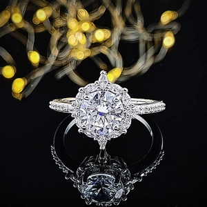Macro shot of a classic halo diamond ring with pavé setting and sparkling moissanite stones