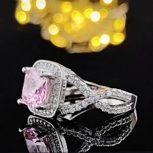 Classic silver ring with large square pink gemstone and braided micro-pave band