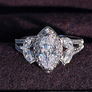 Elegant marquise cut zircon wedding ring with pavé diamonds on a split band design