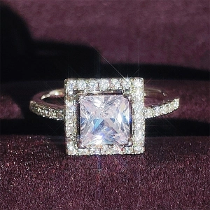 Princess cut cubic zirconia halo ring in silver finish with pavé set band