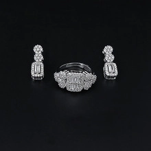 Detail of rectangular zircon jewelry set with emerald cut stones and pave setting