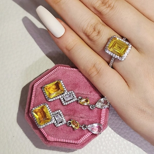 Exquisite jewelry set featuring emerald-cut yellow stones and micro-pave diamonds detail