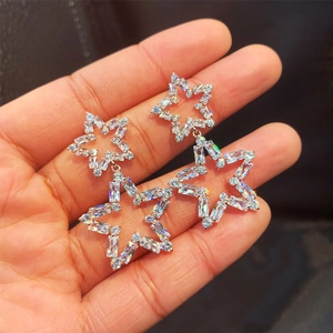 Luxe silver hollow star earrings with sparkling zircon crystals for party wear