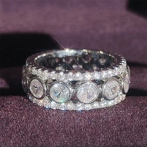 Three-row hollow round silver ring with micro-pave zircons and large center stones