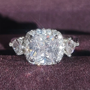 Three-stone cushion cut square halo ring with side pear stones and silver adjustable band