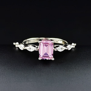 Classic silver ring with emerald cut pink gemstone and marquise side stones