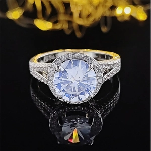 Classic silver-tone halo engagement ring with a round center stone and split pavé band