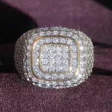 Macro shot of luxury square hip hop ring with iced out diamonds on purple velvet