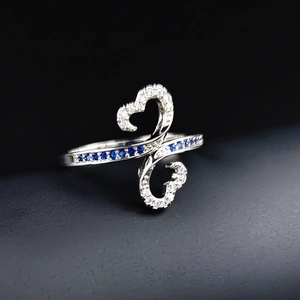 Minimalist double heart silver-colored ring with white zircon and blue gemstone accents