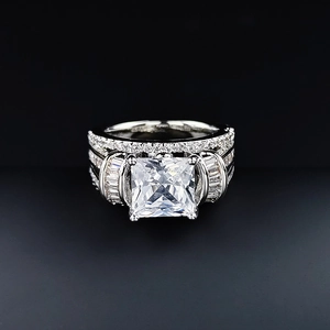 Elegant square-cut cubic zirconia cocktail ring with baguette side stones on silver band