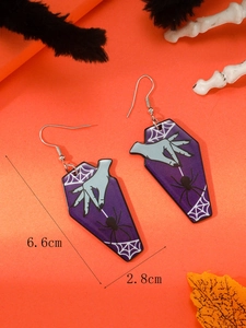 Detail showing acrylic coffin earrings with spider web print and 6.6cm size dimensions