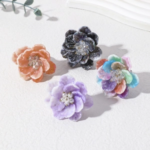 Colorful resin flower rings set with white pearls and crystals in a fresh sweet style