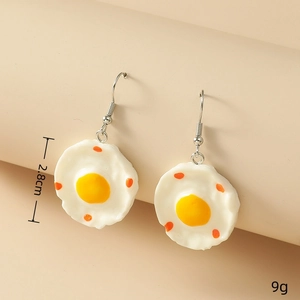 Creative fried egg earrings with resin yolk and 2.8cm height detail on beige background