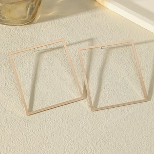 Minimalist oversized gold square hoop earrings with geometric metal frame design