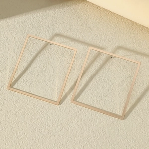 Minimalist oversized gold square hoop earrings with geometric metal frame for women