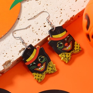 Detail of Halloween acrylic black cat earrings with hat and polka dot bow tie accessory