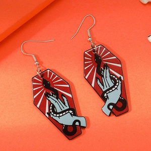 Spooky Halloween coffin earrings featuring a ghostly hand and snake on orange background