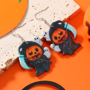Close-up of Halloween acrylic pumpkin grim reaper earrings on a textured stone surface