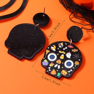 Detailed view of acrylic Halloween earrings featuring cartoon ghost and pumpkin patterns