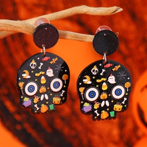 Detail of Halloween skull earrings featuring colorful candy and ghost prints on black acrylic