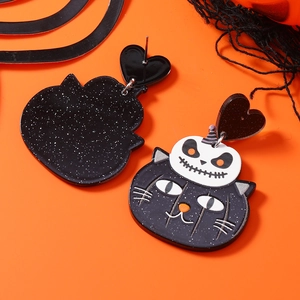 Detail of Halloween black cat and skull acrylic earrings with glitter finish and heart studs