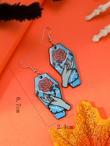 Macro shot showing coffin shaped acrylic earrings dimensions 6.7cm by 2.4cm with rose detail