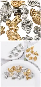 Macro view of gold and silver CCB pendants for DIY jewelry with Fu characters
