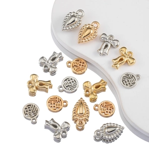 DIY jewelry charms in gold and silver including butterfly, water drop, and Fu fortune shapes
