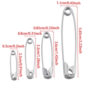 Detailed size comparison chart showing four different sizes of stainless steel safety pins