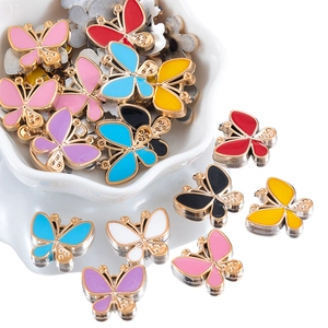 Macro view of colorful butterfly enamel charms for DIY jewelry and hair accessories