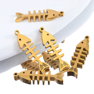 Detailed view of golden stainless steel fishbone charms with hollow design for jewelry making