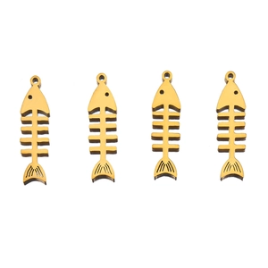 Detail view of four gold-plated fishbone pendants with smooth finish for DIY jewelry
