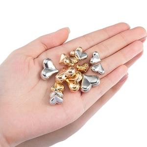 Golden and silver heart-shaped metal beads with mirror finish for DIY jewelry making