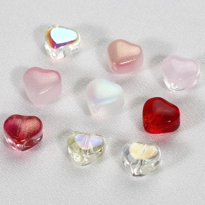 Macro detail of 6mm candy-colored glass heart beads for DIY jewelry accessories and crafts