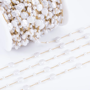 Close-up of Baroque irregular faux pearl beaded chain on a spool for DIY jewelry making