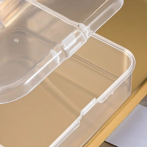 Detail view of the hinge structure and rounded edges of the transparent plastic storage box