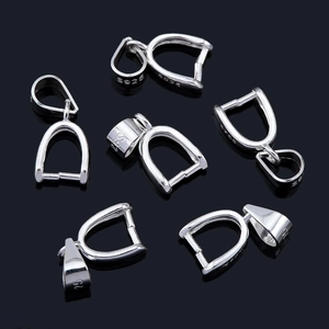 Multiple S925 sterling silver pinch bails for pendants shown on a black reflective surface
