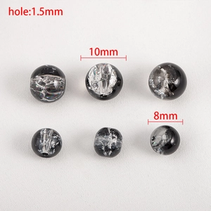 Detailed view of 8mm and 10mm lampwork beads with silver foil inlay and 1.5mm holes
