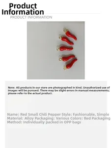 Macro detail of red chili pendants made of alloy with golden loops for jewelry DIY