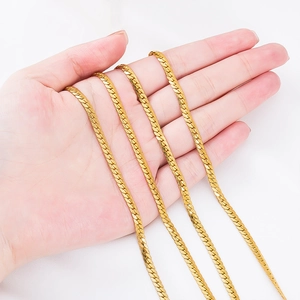 Detailed close-up of golden herringbone chain with premium metallic luster and smooth texture