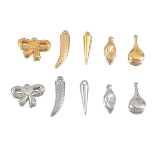 Assorted gold and silver DIY jewelry pendants including bows, horns and water drops