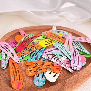 Detailed close-up of colorful floral and animal pattern metal teardrop hair clips set