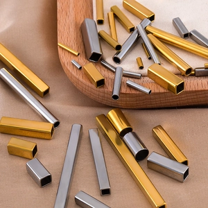 Detailed close-up of hollow gold and silver stainless steel tubes for DIY jewelry making