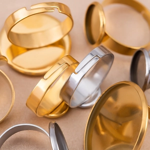 Close-up of gold and silver adjustable stainless steel ring bases for DIY jewelry making